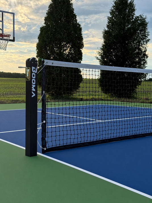 Image du système de filet de pickleball encastré au sol BOOMA.